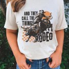 White AND THEY CALL THE THING RODEO Graphic Crewneck Tee
