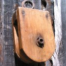 Old wooden rope pulley with wood wheel ec