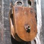 Old wooden rope pulley with wood wheel ec