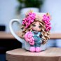 A hand made mug withdecor doll made of polymer clay.