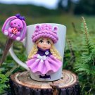 A hand made set, mug with spoon, decor made of polymer clay.