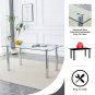 A modern minimalist style glass dining table. Transparent tempered glass tabletop