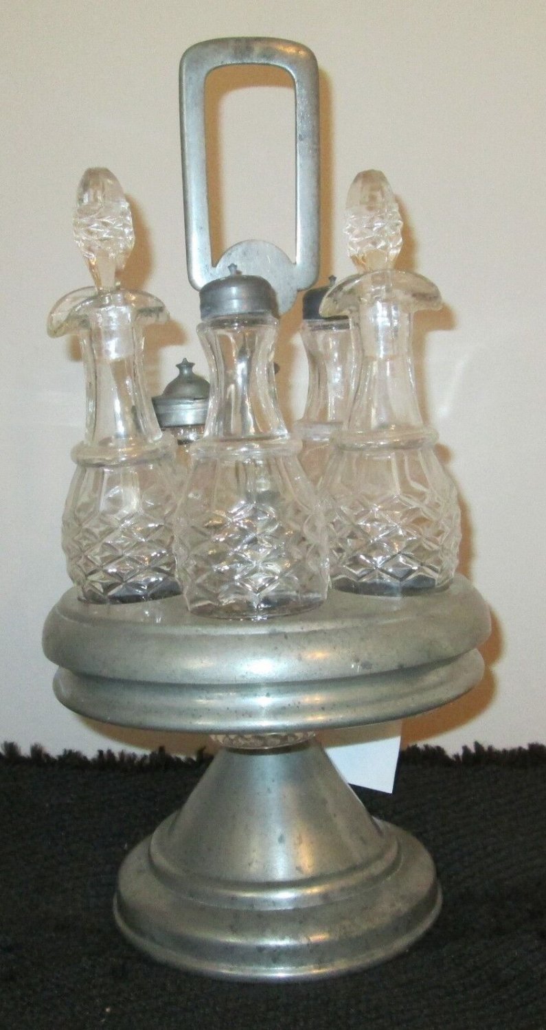 EARLY 1900's SILVER PLATE CASTOR SET WITH 5 MATCHING GLASS CONTAINERS