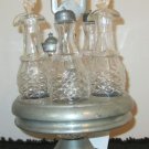 EARLY 1900's SILVER PLATE CASTOR SET WITH 5 MATCHING GLASS CONTAINERS EARLY 1900's SILVER PLATE CASTOR SET WITH 5 MATCHING GLASS CONTAINERS