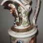 Porcelain pitcher or ewer   hand painted Majolica People