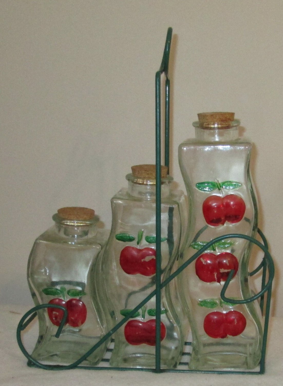 SET OF THREE GLASS BOTTLES CHERRIES CRUETS WIRE BASKET HOLDER