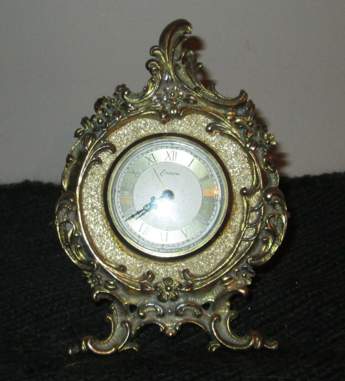 VINTAGE ENDURA FLORAL BRASS ROUND ALARM CLOCK FOOTED WEST GERMANY
