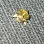 LAPEL PIN CUPID HOLDING HEART GOLD IN COLOR