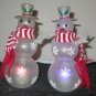 TWO BATTERY OPERATED HANDICAP SNOW PEOPLE SNOWMEN
