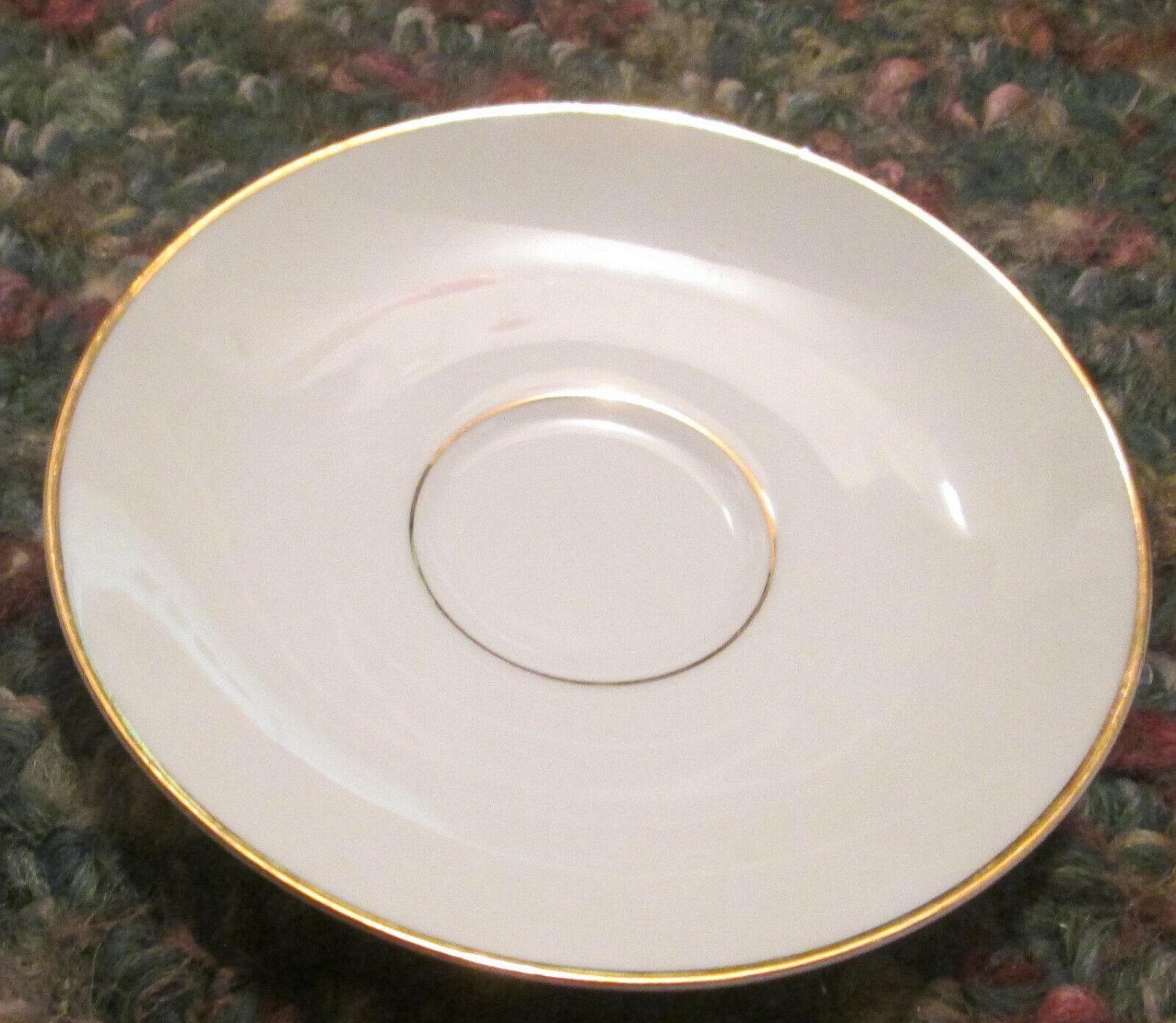 Saucer, White with Gold trim. Clearly marked in Gold, made in Germany