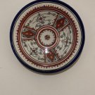 "Exquisite Elegance: Unveiling the Intricate Beauty of an Antique Ornate Dish"