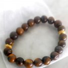 Tiger's eye beaded elastic bracelet & spacers gold plated Tiger's eye beaded elastic bracelet & spacers gold plated