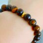 Tiger's eye beaded elastic bracelet & spacers gold plated