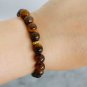 Tiger's eye beaded elastic bracelet & spacers gold plated