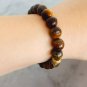 Tiger's eye beaded elastic bracelet & spacers gold plated