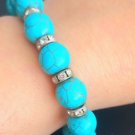 TURQUOISE elastic beads bracelet with spacer in Swarovski white crystals in gift pouch TURQUOISE elastic beads bracelet with spacer in Swarovski white crystals in gift pouch