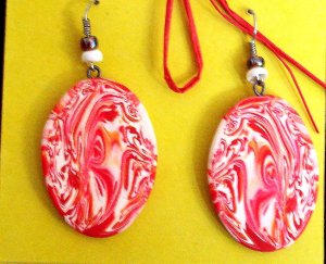 Red and white swirly disk earrings