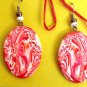 Red and white swirly disk earrings
