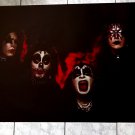 KISS WITH BLACK BACKGROUND AND 4 FACE SHOWN ON VINTAGE 24 X 36 INCHES POSTER!!