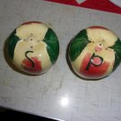a pair of apple-shaped salt and pepper shakers