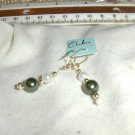 handmade pair of Christmas green on white pearls earrings.