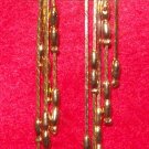 Fashion, Costume Jewelry, a pair of Gold 4" dangling earrings