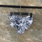 Dior strapless split bikini with detachable shoulder straps suitable for swimsuits in various sce