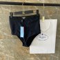 PRADA's new backless one-piece swimsuit in black, simple and atmospheric, suitable for swimming i