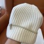 ails of the beige hat!