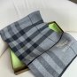 Burberry's popular new high-end men's scarf features a classic warhorse plaid pattern