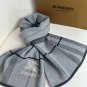 Burberry's popular new high-end men's scarf features a classic warhorse plaid pattern