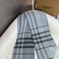 Burberry's popular new high-end men's scarf features a classic warhorse plaid pattern