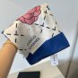ch 110Chanel's new Xiaoxiang No. 5 Accessory Square Scarf is a silk square scarf th