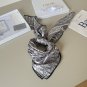 ch 110Dior classic printed handkerchief pays tribute to the classic Oblique print.T_4249