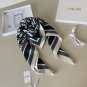 ch 110Dior classic printed handkerchief pays tribute to the classic Oblique print.T_5654