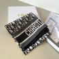 ch 110Dior classic printed handkerchief pays tribute to the classic Oblique print.T_5701