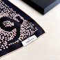 hundred and seventy-fiveA rare Chanel used silk scarf with a clever pattern of white