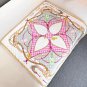 hundred and thirtyThe Flower And Straps silk handkerchief showcases an elegant style