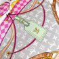 hundred and thirtyThe Flower And Straps silk handkerchief showcases an elegant style