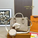 135 fold box Lv tote with wide shoulder strap and small coin purse. Size is just right 25