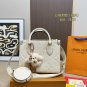 135 fold box Lv tote with wide shoulder strap and small coin purse. Size is just right 25