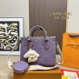 135 fold box Lv tote with wide shoulder strap and small coin purse. Size is just right 25