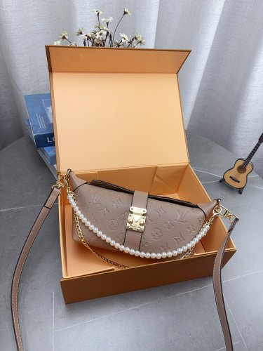 Comes with a foldable gift boxLV Pochette Mia handbag from Louis Vuitton, featuring clas