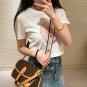 LV  The magic stick is really easy to carry!! Both shoulder and crossbody look good~Lv'