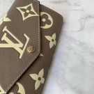 p100The LV M80496 elegantly completes the portofoilysara with a beautiful two-color mo
