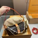 p120D-108 size 21 × 12 folding boxThe LV Pochette Mia handbag from Louis Vuitton has