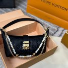 P125 gift box packagingLV Pochette Mia handbag from Louis Vuitton, featuring classic Mon