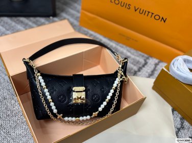 P125 gift box packagingLV Pochette Mia handbag from Louis Vuitton, featuring classic Mon