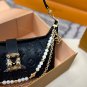 P125 gift box packagingLV Pochette Mia handbag from Louis Vuitton, featuring classic Mon