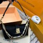 P125 gift box packagingLV Pochette Mia handbag from Louis Vuitton, featuring classic Mon